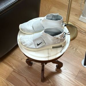 Nike Fear of God Moccasins size 10 men’s encased in a plastic box.